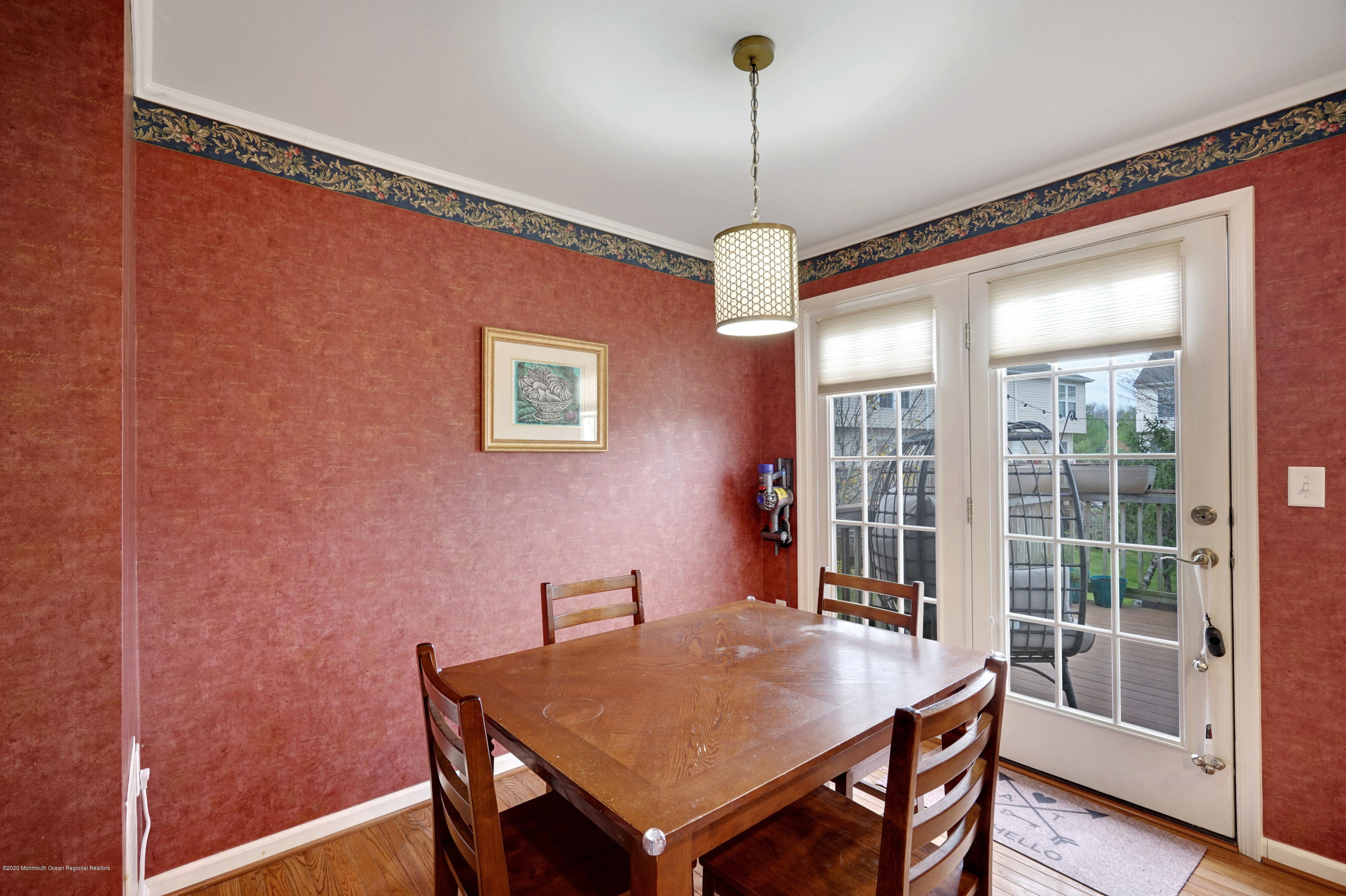 60 Saxton Road, Unit 87 Farmingdale, NJ 07727 - Photo 11 of 38 a view of a dining room with furniture window and wooden floor