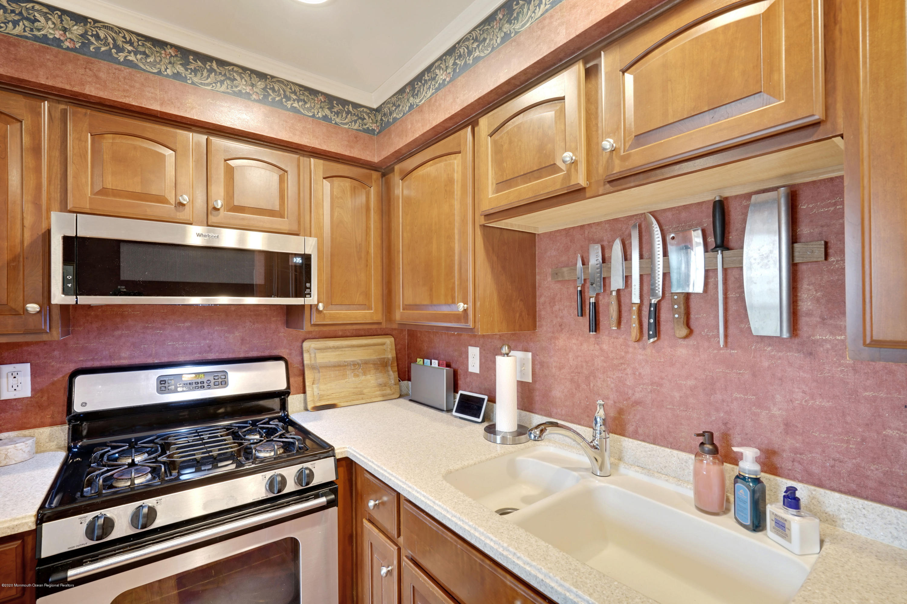 60 Saxton Road, Unit 87 Farmingdale, NJ 07727 - Photo 14 of 38 a kitchen with granite countertop a stove and a sink