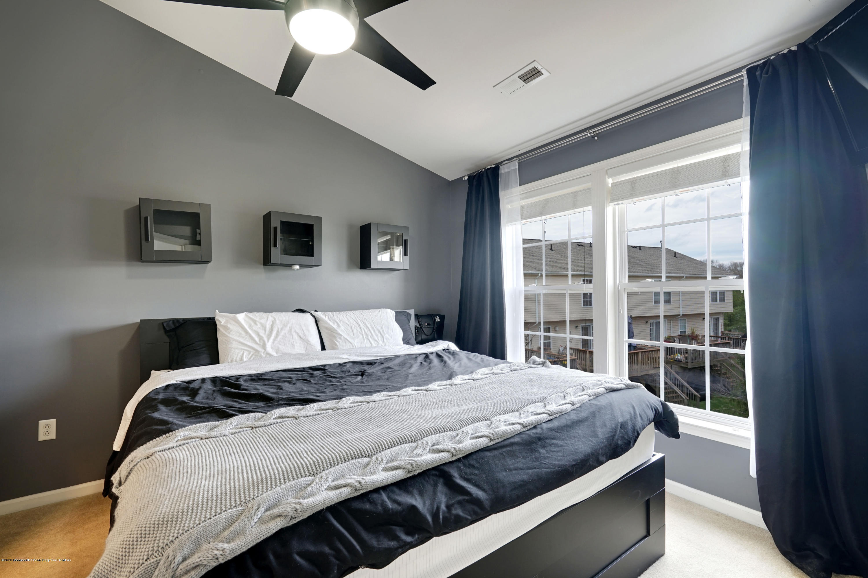 60 Saxton Road, Unit 87 Farmingdale, NJ 07727 - Photo 18 of 38 a bedroom with a large bed and a window