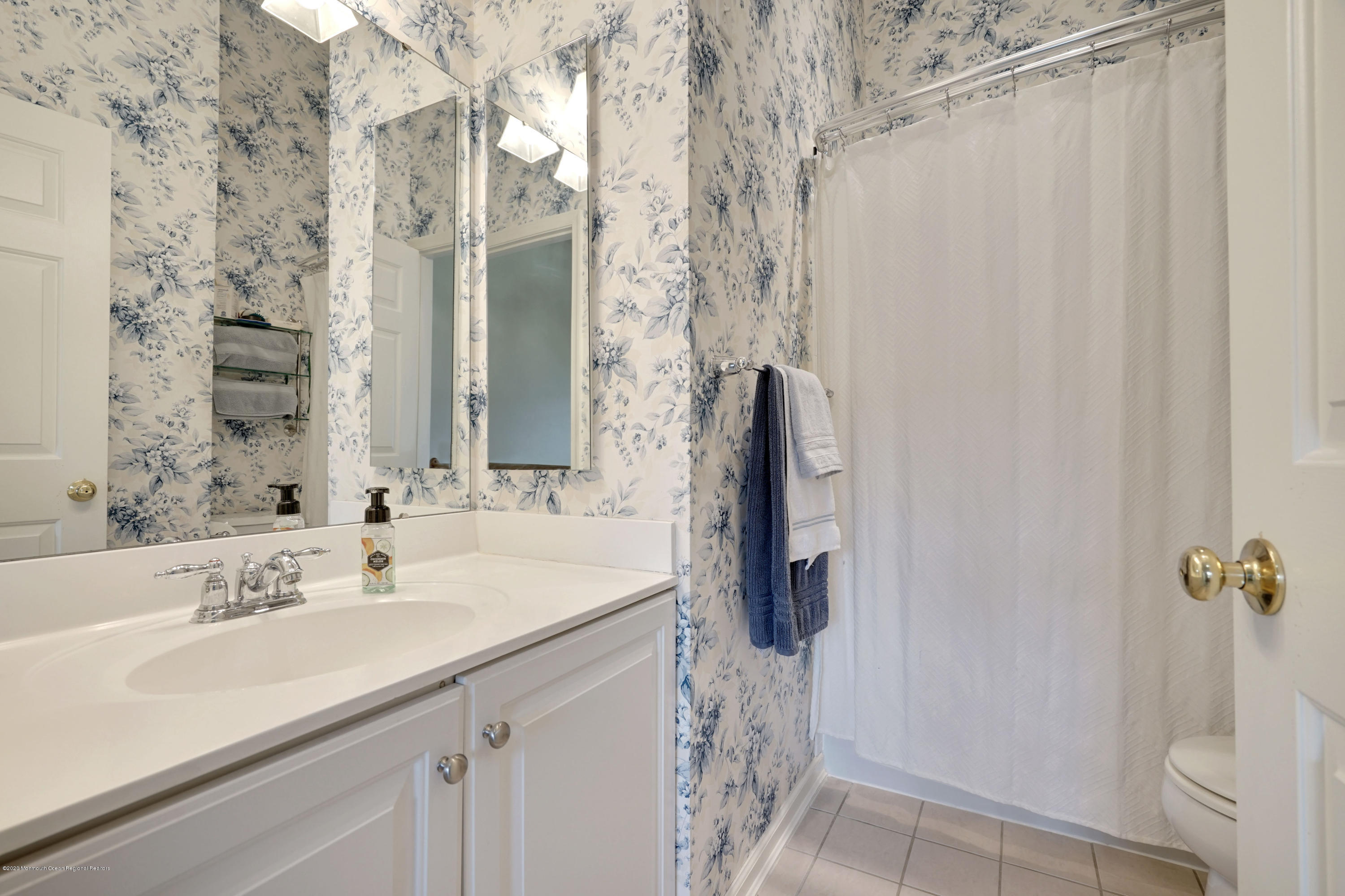 60 Saxton Road, Unit 87 Farmingdale, NJ 07727 - Photo 27 of 38 a bathroom with a sink and a mirror