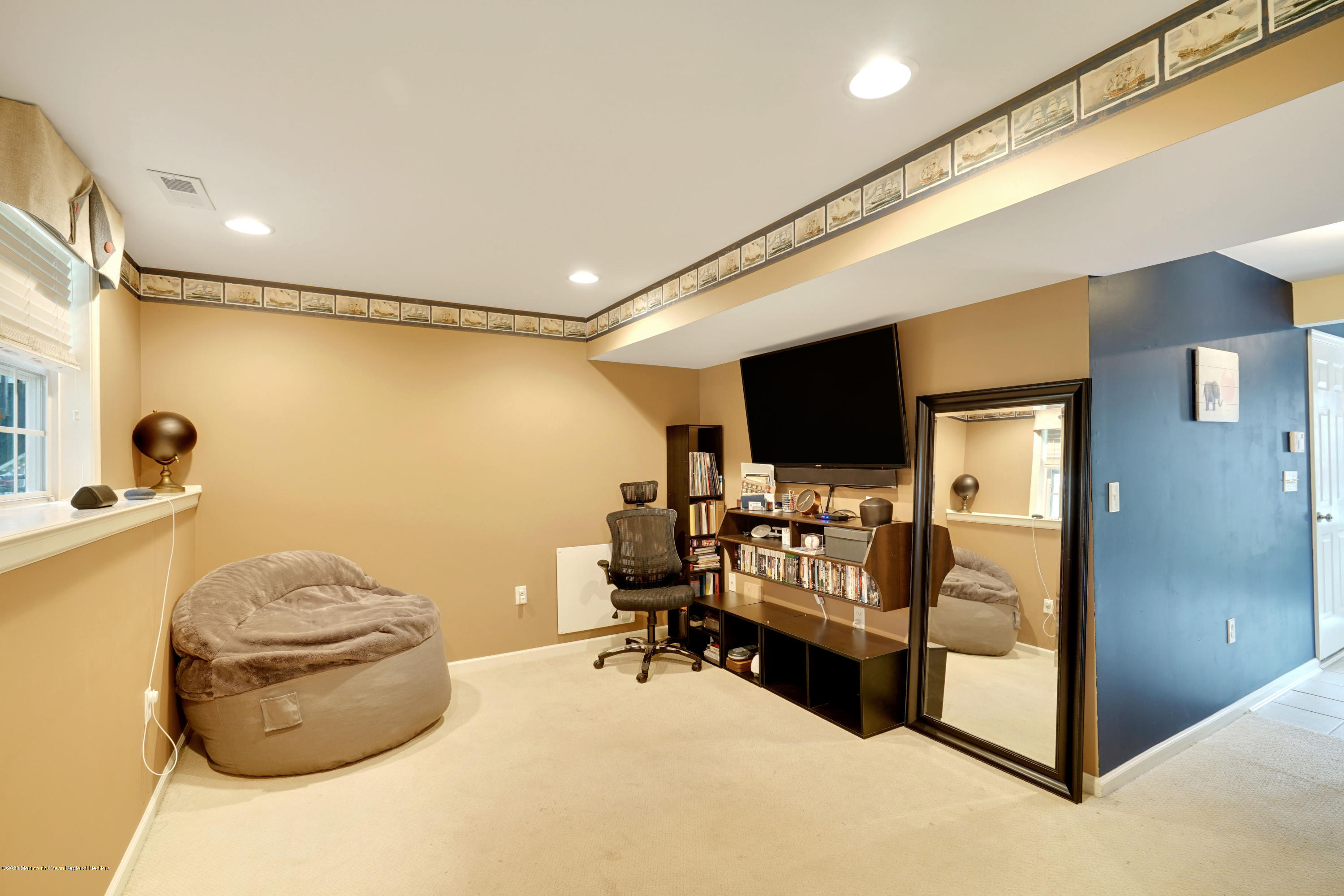 60 Saxton Road, Unit 87 Farmingdale, NJ 07727 - Photo 30 of 38 a living room with furniture and a flat screen tv