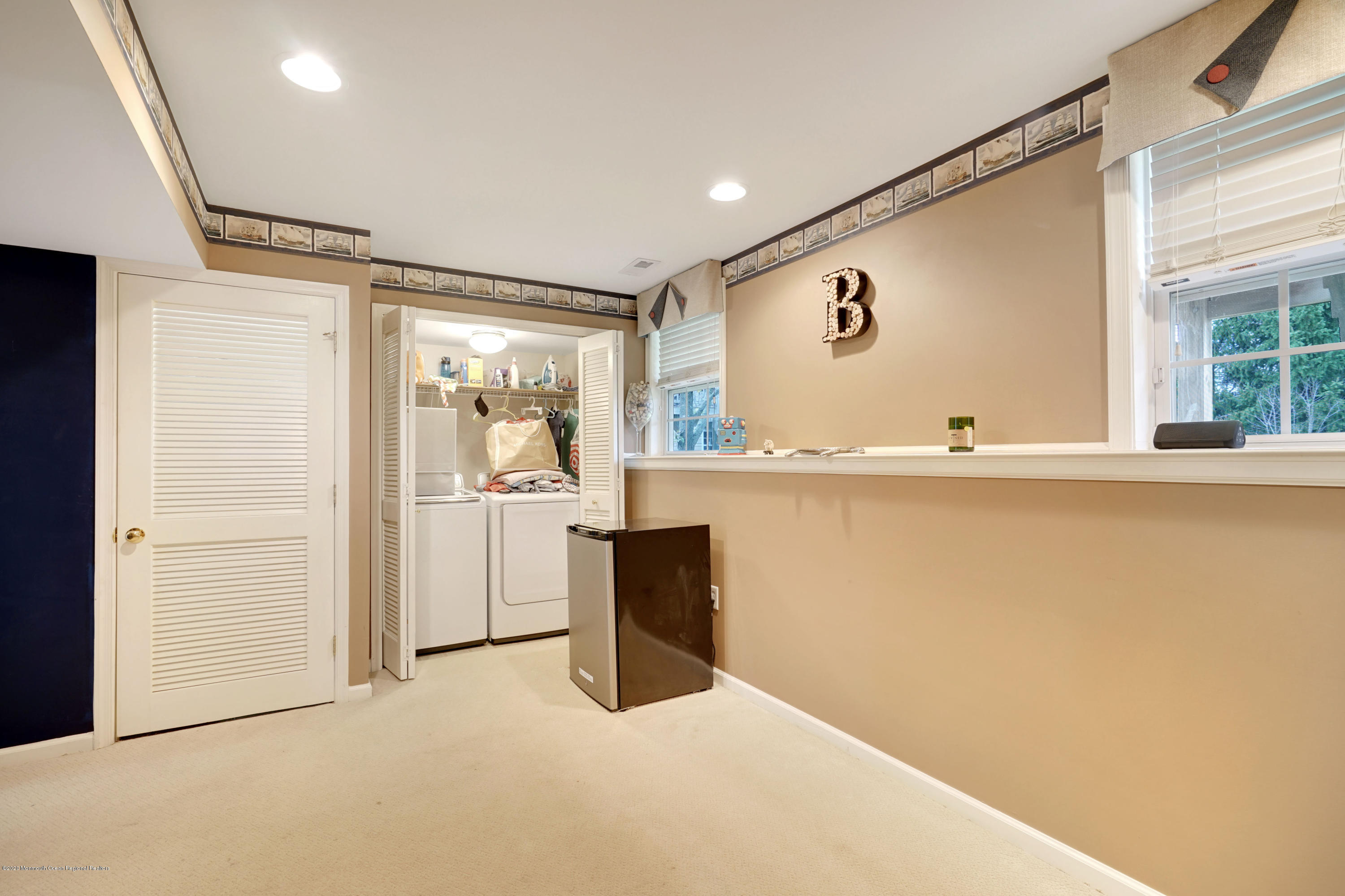 60 Saxton Road, Unit 87 Farmingdale, NJ 07727 - Photo 32 of 38 a view of a big room with wooden floor and windows