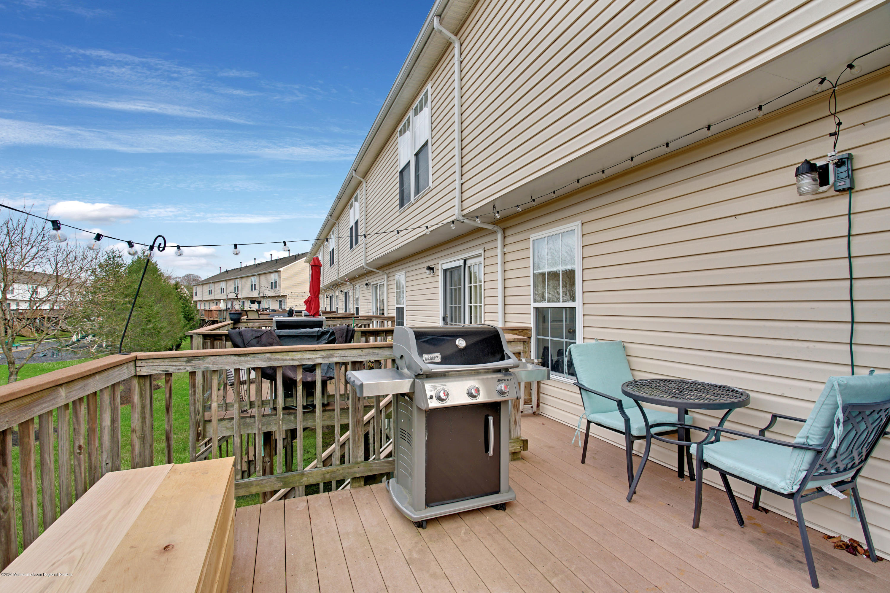 60 Saxton Road, Unit 87 Farmingdale, NJ 07727 - Photo 34 of 38 a view of a chairs and table on the deck
