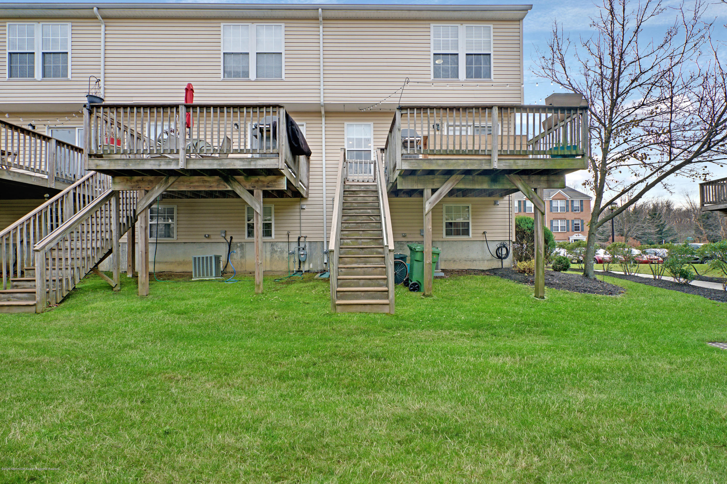 60 Saxton Road, Unit 87 Farmingdale, NJ 07727 - Photo 36 of 38 a view of a house with a garden and deck