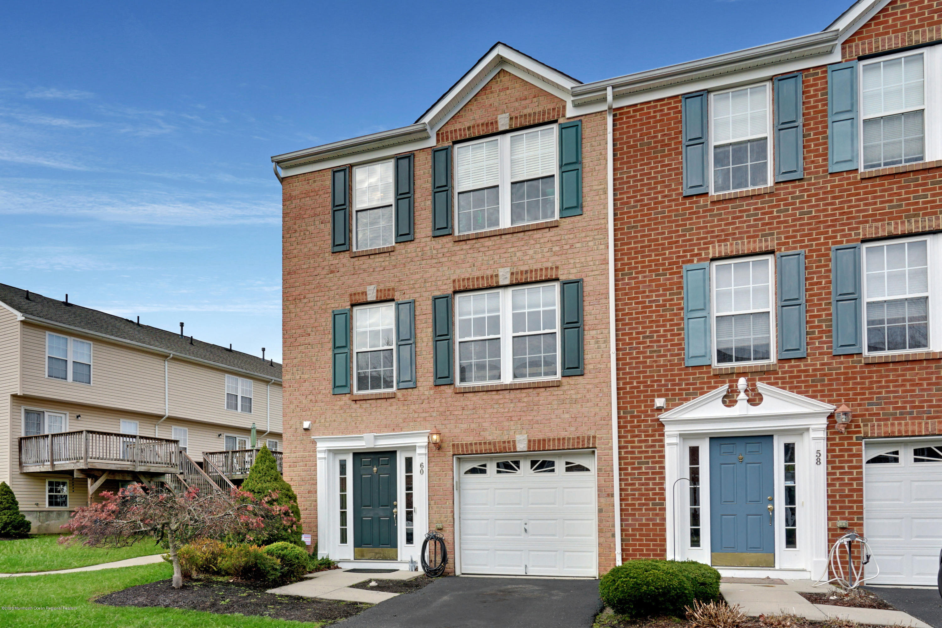 60 Saxton Road, Unit 87 Farmingdale, NJ 07727 - Photo 37 of 38 a front view of a building with garden