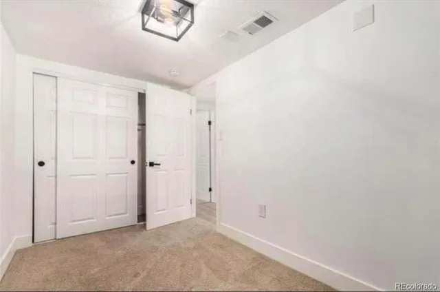 a bath room with a toilet a sink and a bath tub