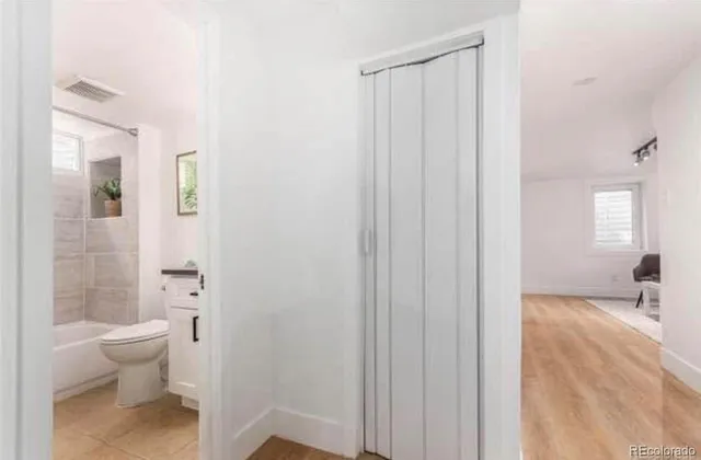 a backyard of a house with shaded area