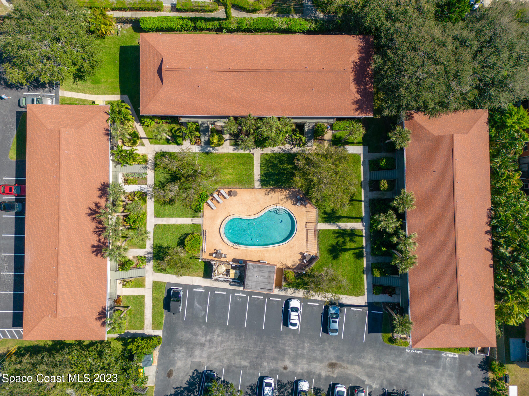 500 Catalina Road, Unit 103 Cocoa Beach, FL 32931 - Photo 22 of 28 an aerial view of a house with yard swimming pool and outdoor seating