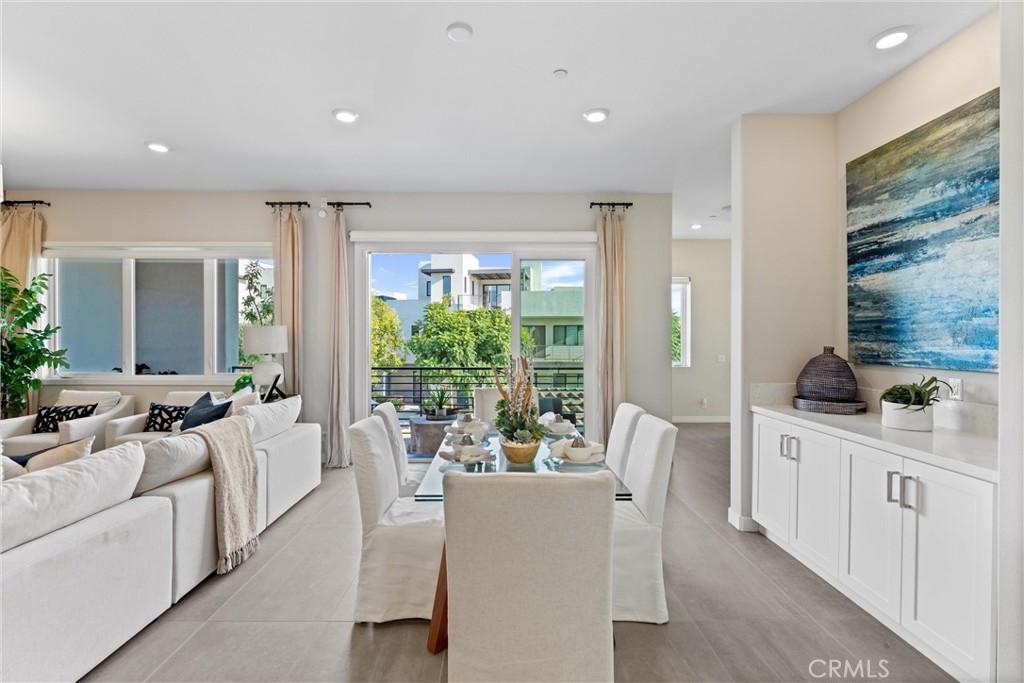 419 Transport Tustin, CA 92782 - Photo 12 of 58 a living room with furniture a large window and a potted plant