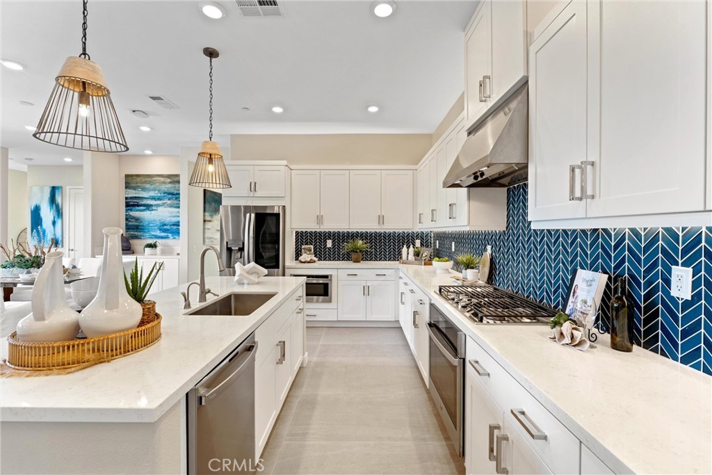 419 Transport Tustin, CA 92782 - Photo 16 of 58 a kitchen with a sink stove and cabinets