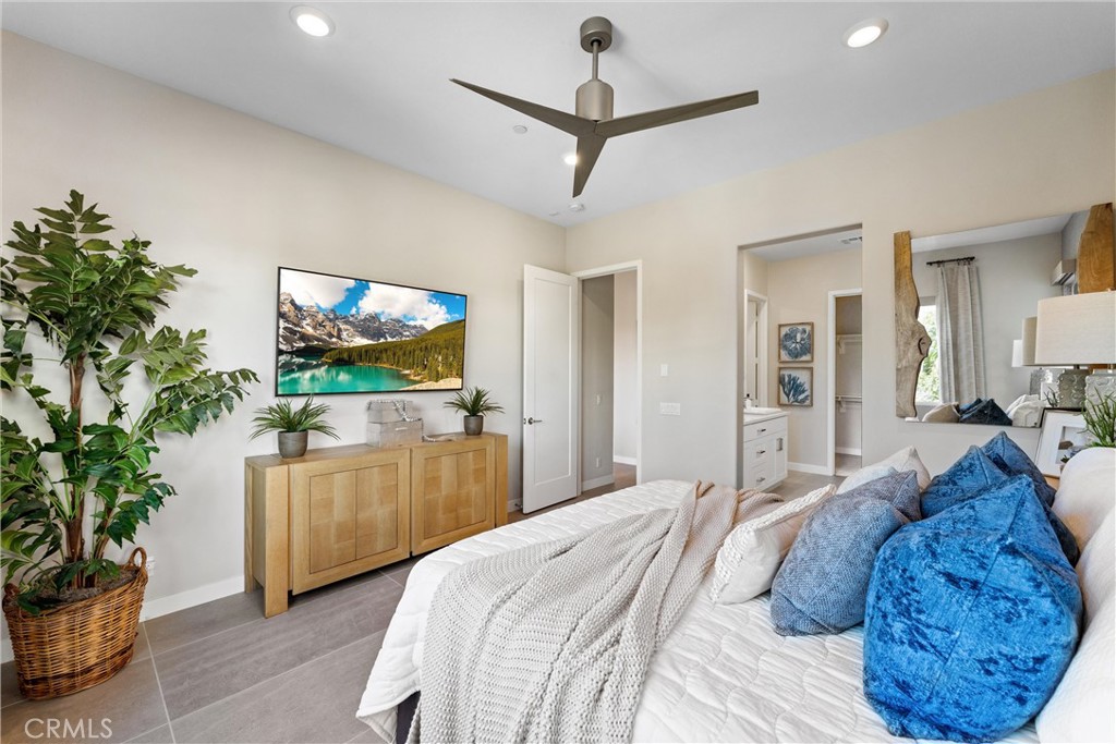 419 Transport Tustin, CA 92782 - Photo 22 of 58 a bedroom with a bed and a flat screen tv