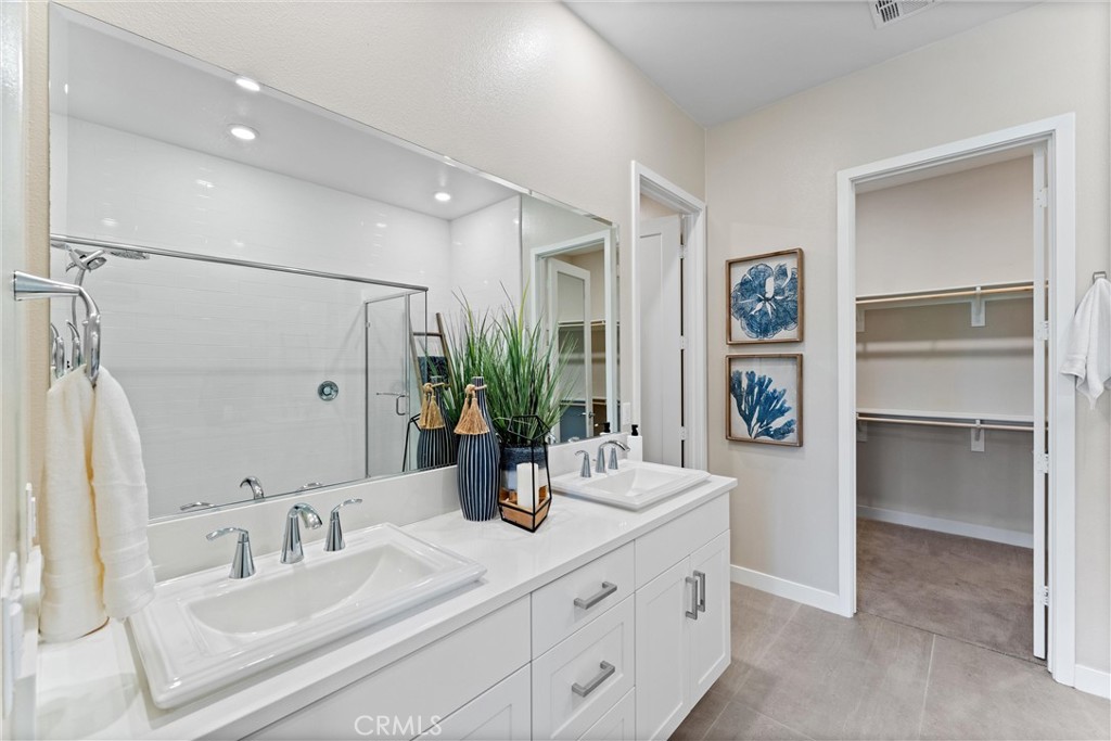 419 Transport Tustin, CA 92782 - Photo 23 of 58 a bathroom with a double vanity sink and a mirror