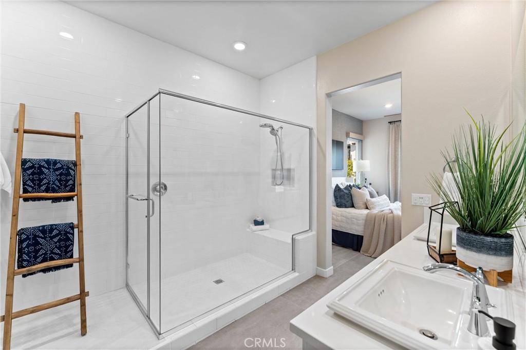 419 Transport Tustin, CA 92782 - Photo 25 of 58 a bathroom with a tub a mirror and shower