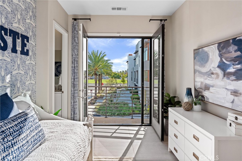 419 Transport Tustin, CA 92782 - Photo 28 of 58 a spacious bedroom with a large bed and a large window