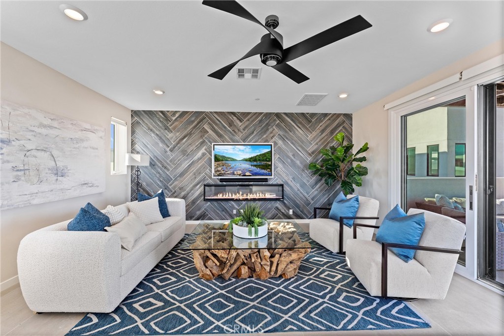 419 Transport Tustin, CA 92782 - Photo 3 of 58 a living room with furniture and a ceiling fan