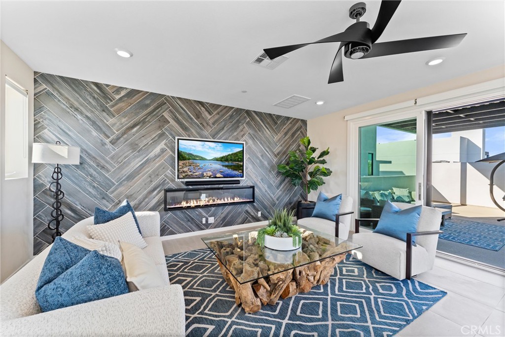 419 Transport Tustin, CA 92782 - Photo 35 of 58 a living room with furniture and a flat screen tv