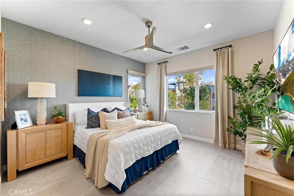 419 Transport Tustin, CA 92782 - Photo 5 of 58 a bedroom with a balcony a bed and a chandelier