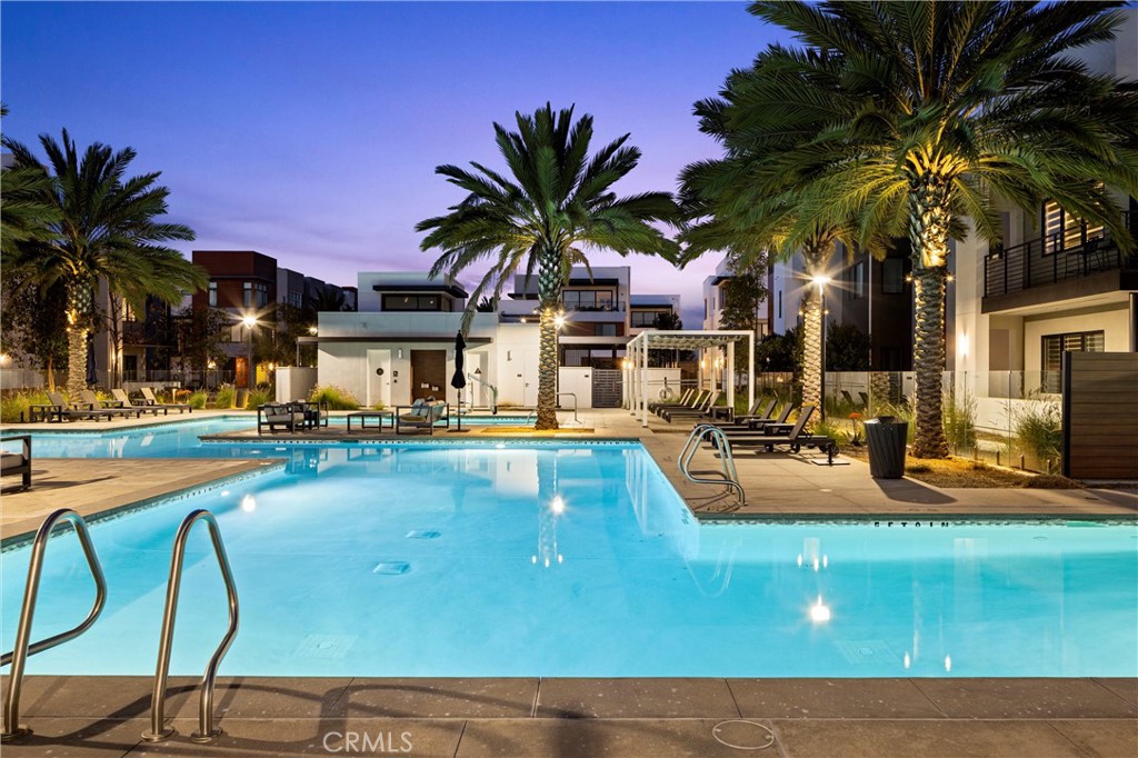 419 Transport Tustin, CA 92782 - Photo 51 of 58 a view of a swimming pool with lounge chairs in front of house