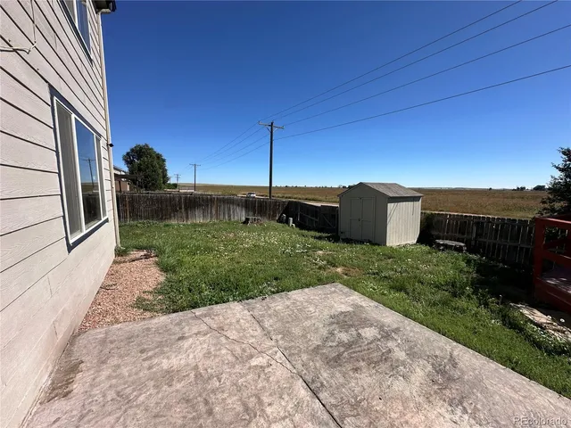 a view of a backyard with potted plants