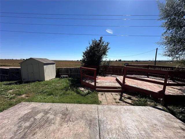a view of a bench in a backyard