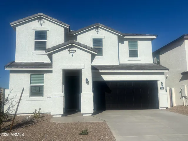 a front view of a house with a garage