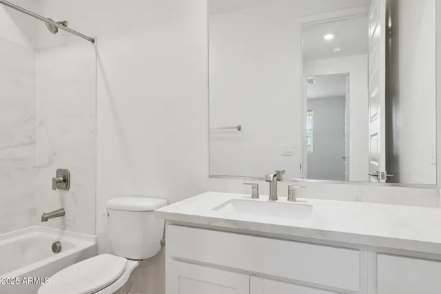 a bathroom with a sink toilet a shower and a mirror