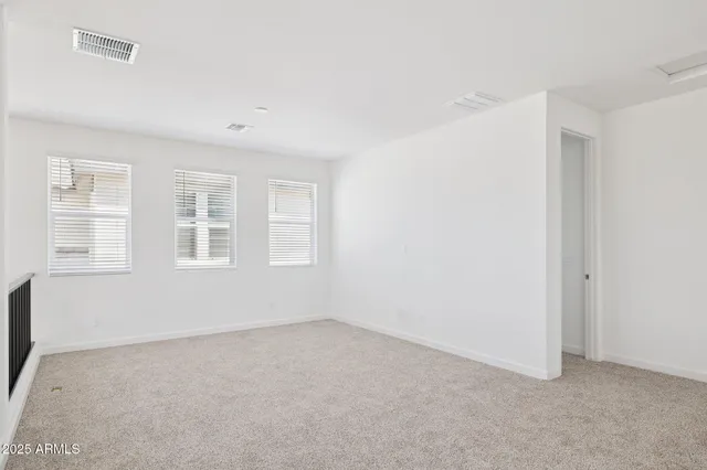 a view of empty room with windows