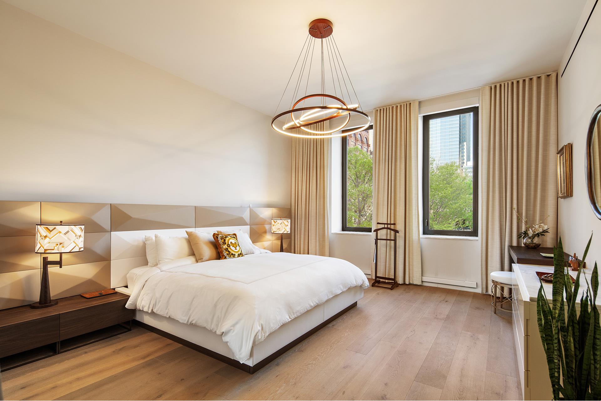 11 Beach Street, Unit THB Manhattan, NY 10013 - Photo 2 of 14 a bedroom with a bed and a chandelier