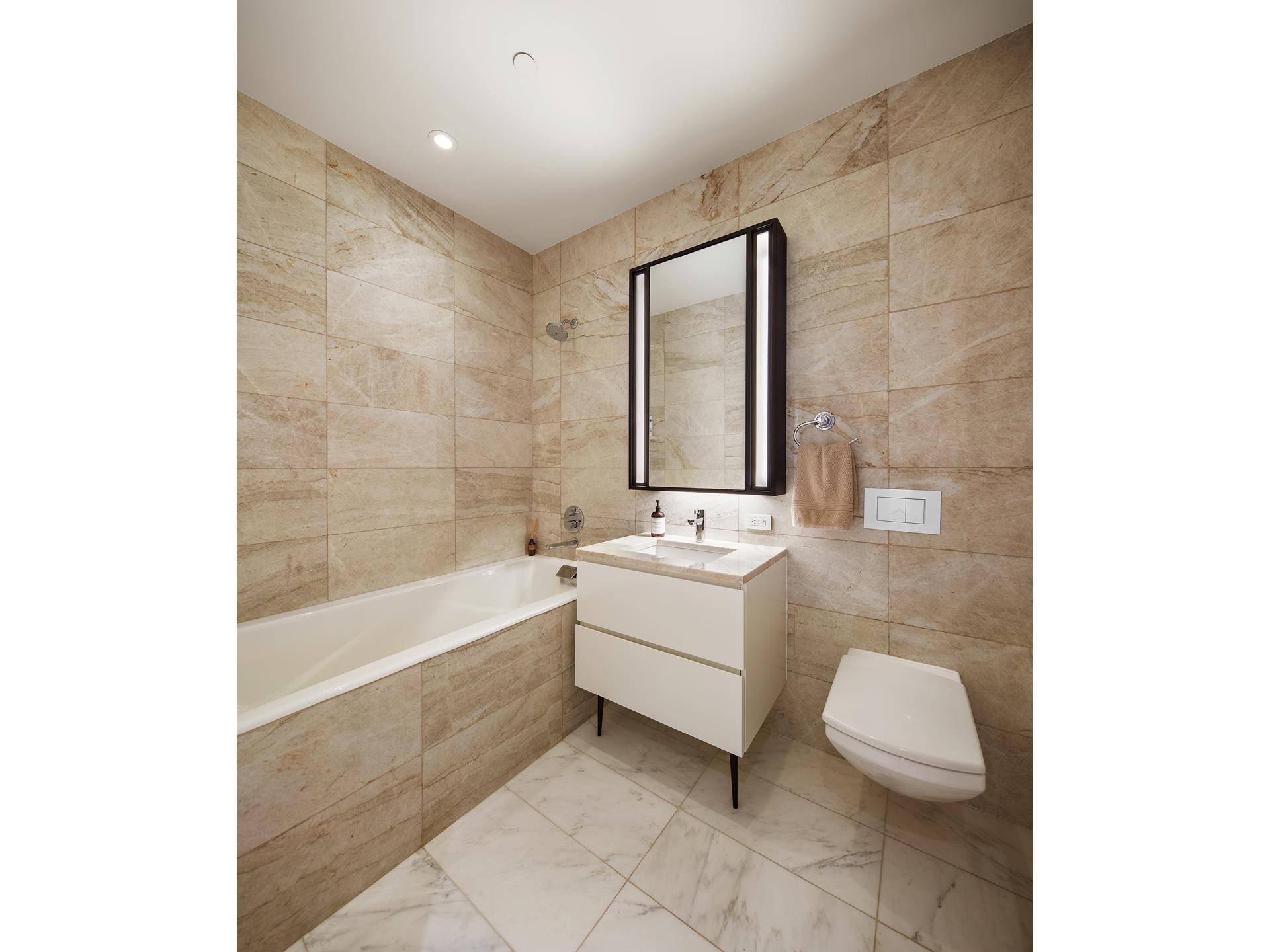 11 Beach Street, Unit THB Manhattan, NY 10013 - Photo 5 of 14 a bathroom with a bathtub sink and toilet