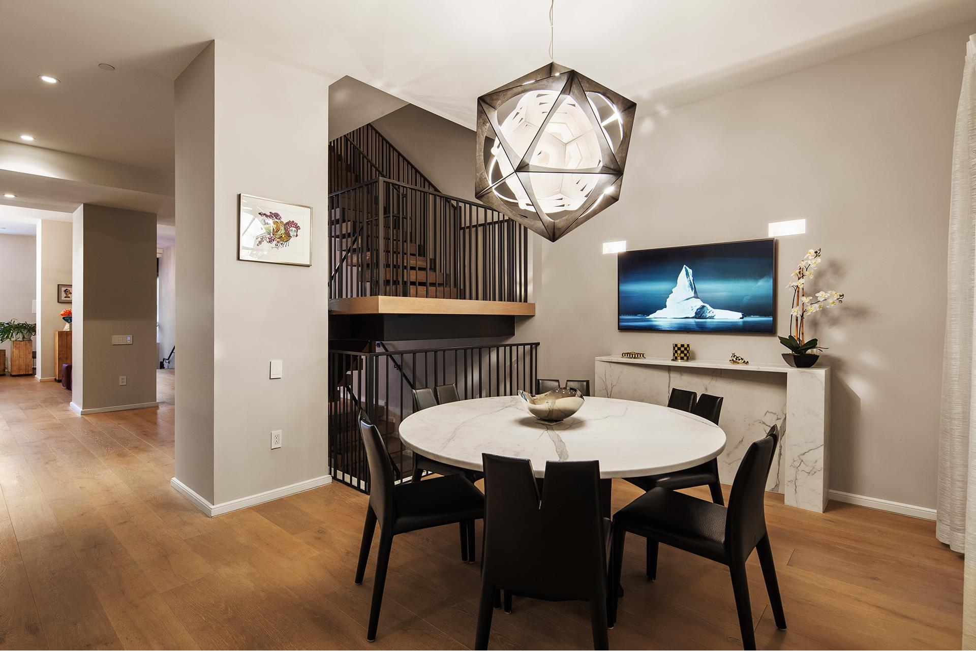 11 Beach Street, Unit THB Manhattan, NY 10013 - Photo 7 of 14 a view of a dining room with furniture wooden floor and a chandelier