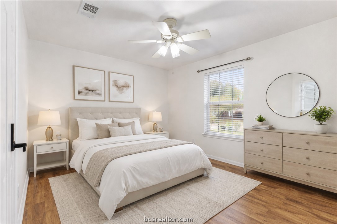 3709 Springfield Drive College Station, TX 77845 - Photo 14 of 23 a bedroom with a large bed and a mirror