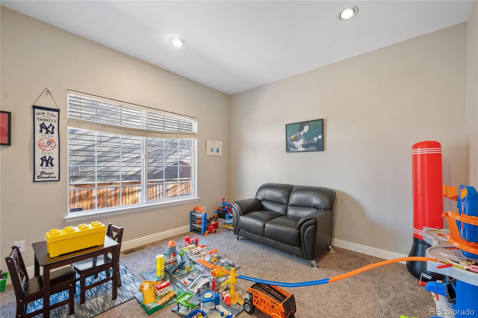 1201 Riddlewood Road Highlands Ranch, CO 80129 - Photo 14 of 36 a living room with furniture and a window