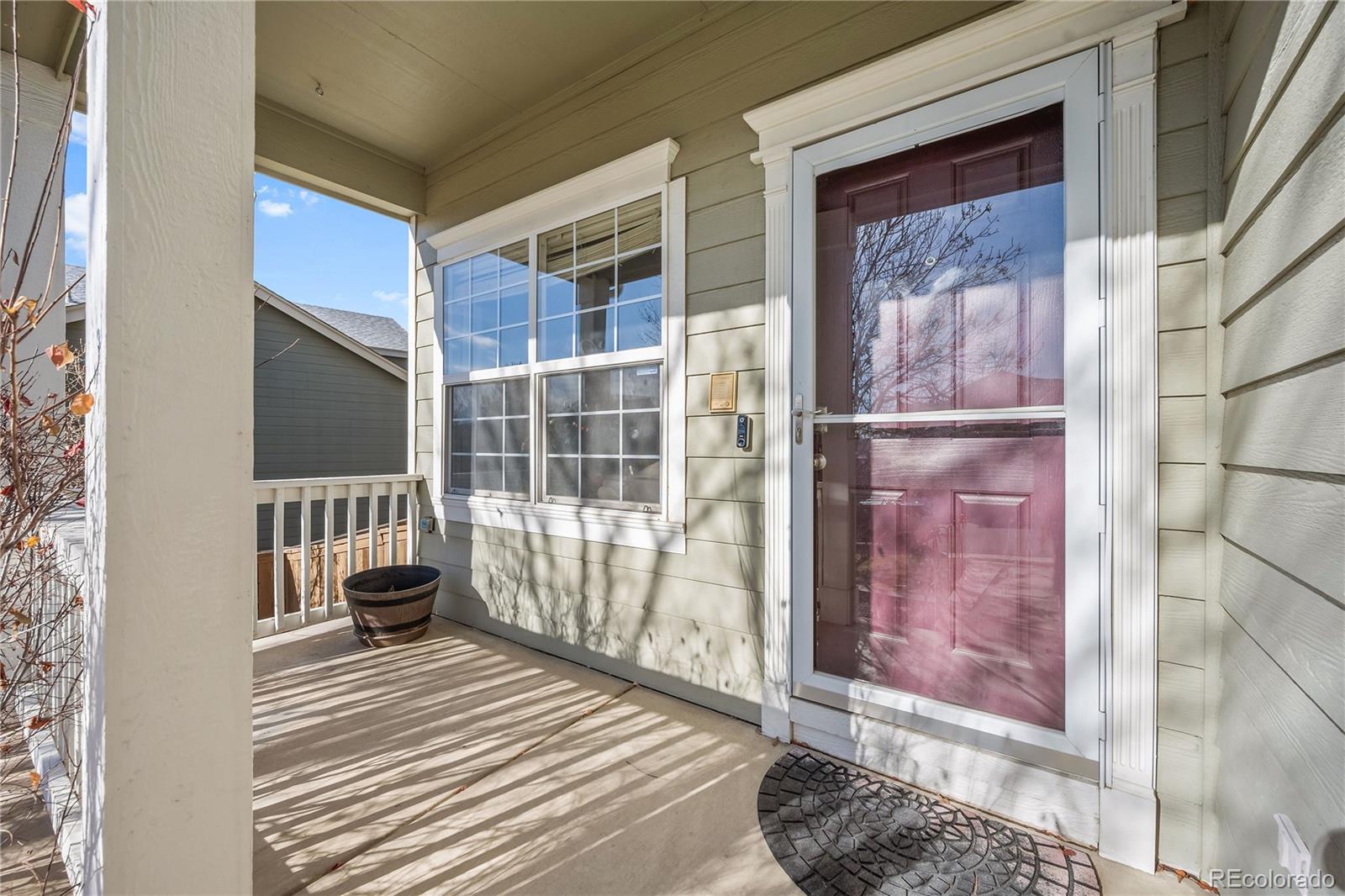 1201 Riddlewood Road Highlands Ranch, CO 80129 - Photo 2 of 36 a view of a balcony with wooden floor