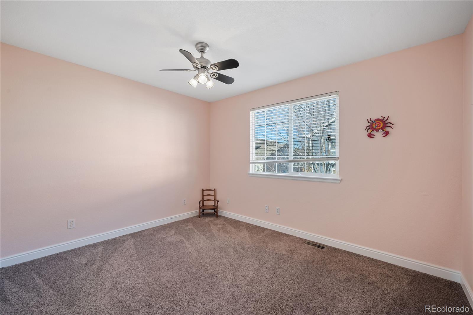 1201 Riddlewood Road Highlands Ranch, CO 80129 - Photo 26 of 36 an empty room with a window and a fan