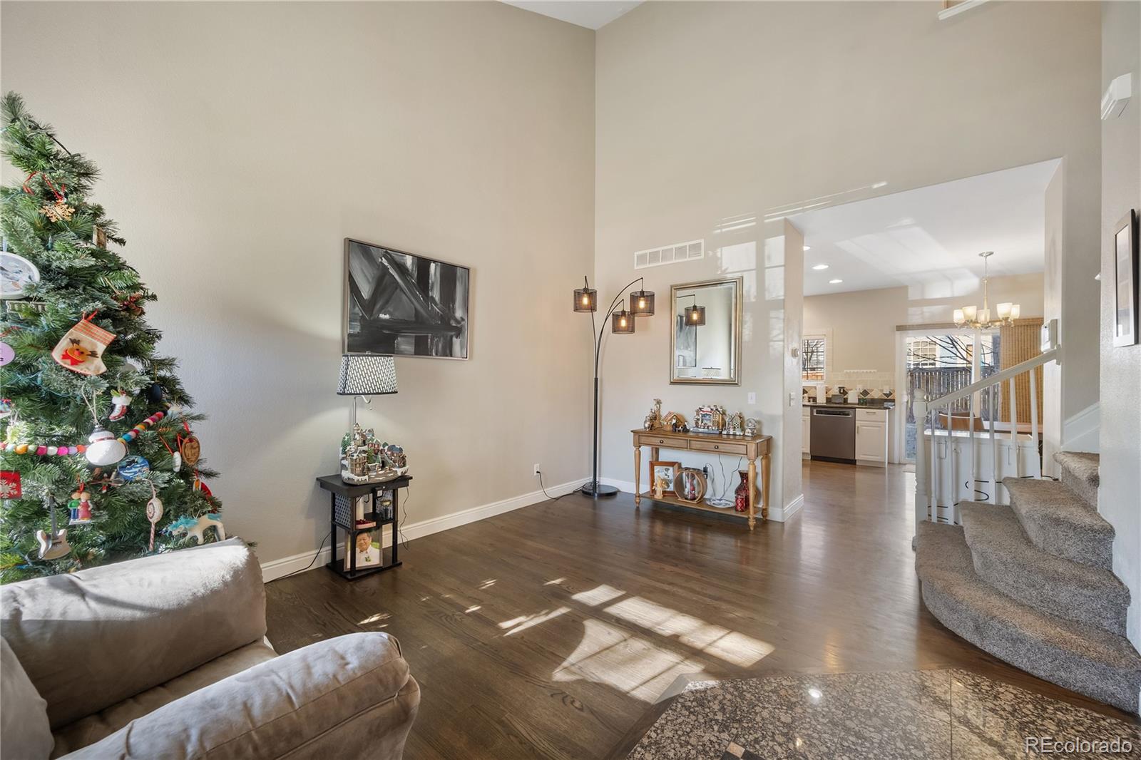 1201 Riddlewood Road Highlands Ranch, CO 80129 - Photo 3 of 36 a living room with furniture and a potted plant