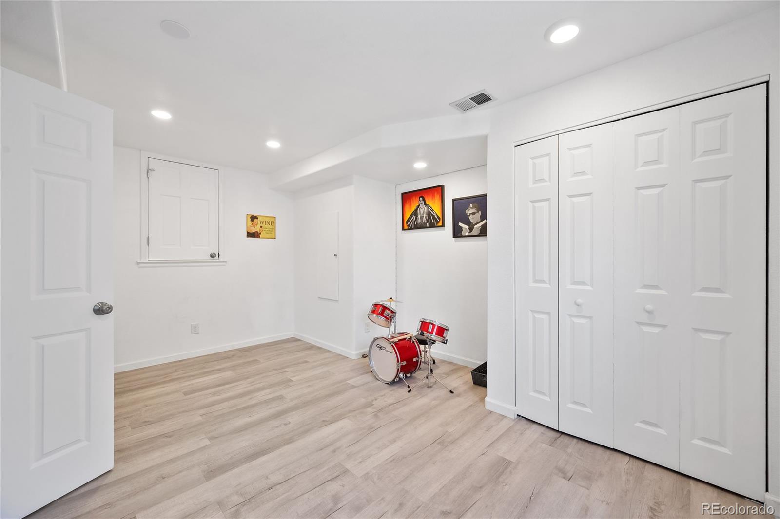 1201 Riddlewood Road Highlands Ranch, CO 80129 - Photo 32 of 36 a view of a livingroom with wooden floor