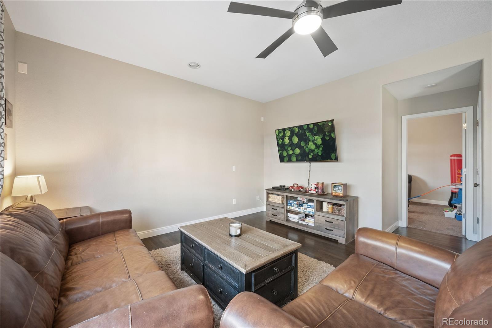 1201 Riddlewood Road Highlands Ranch, CO 80129 - Photo 5 of 36 a living room with furniture and a window
