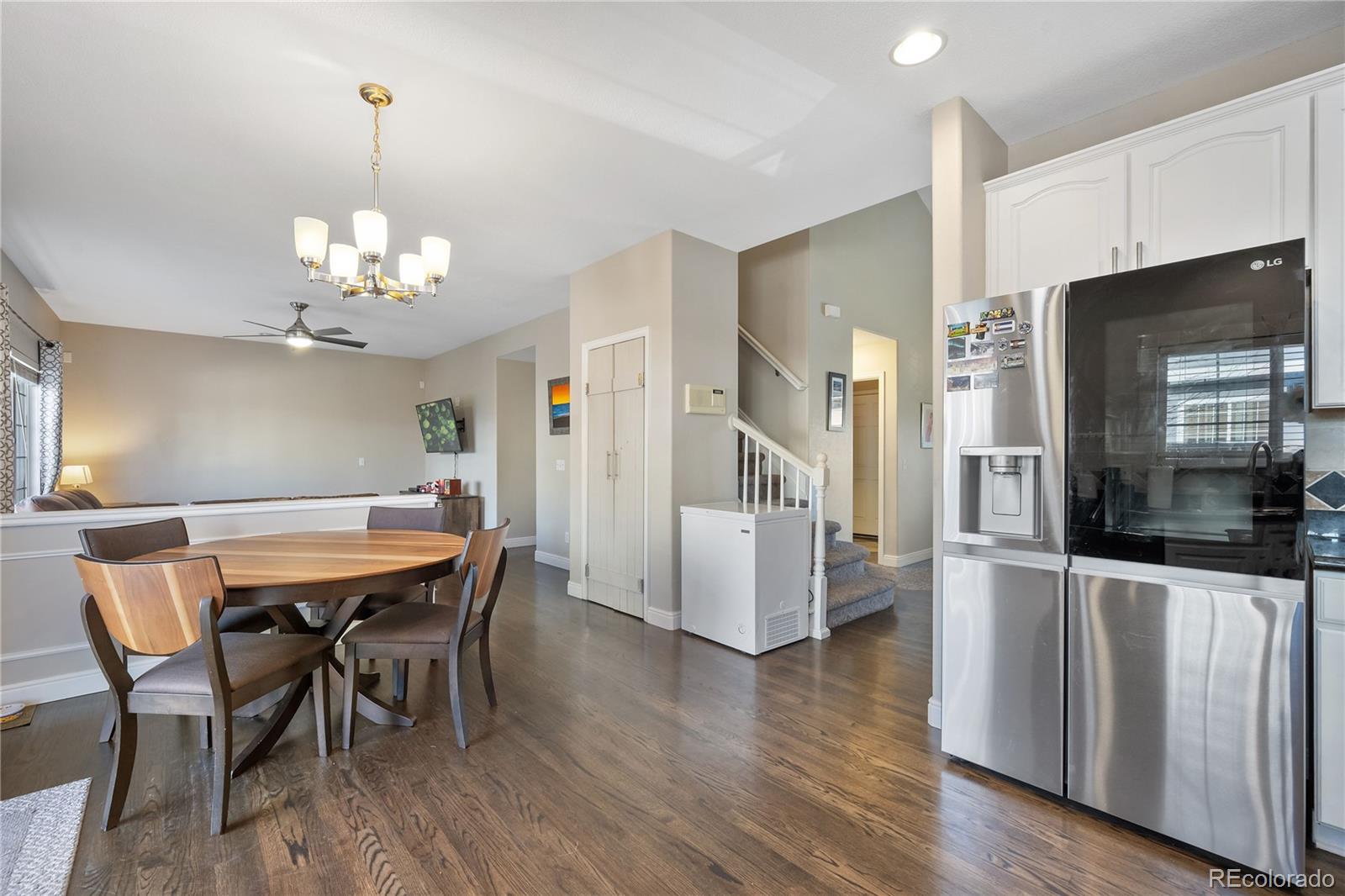 1201 Riddlewood Road Highlands Ranch, CO 80129 - Photo 8 of 36 a view of a dining room with furniture and wooden floor