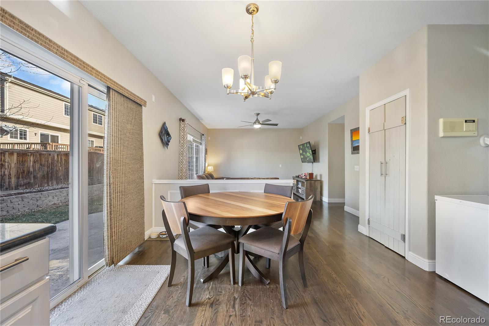 1201 Riddlewood Road Highlands Ranch, CO 80129 - Photo 9 of 36 a view of a dining room with furniture and a chandelier