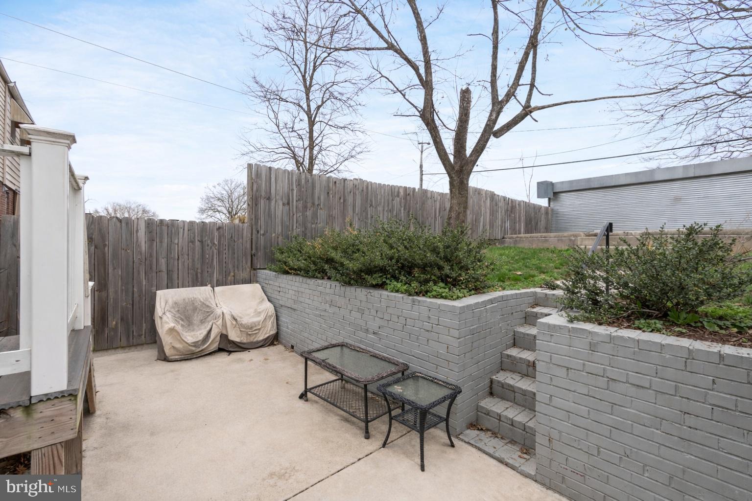 50 53rd Street Southeast Washington, DC 20019 - Photo 30 of 35 a view of a patio with a table and chairs