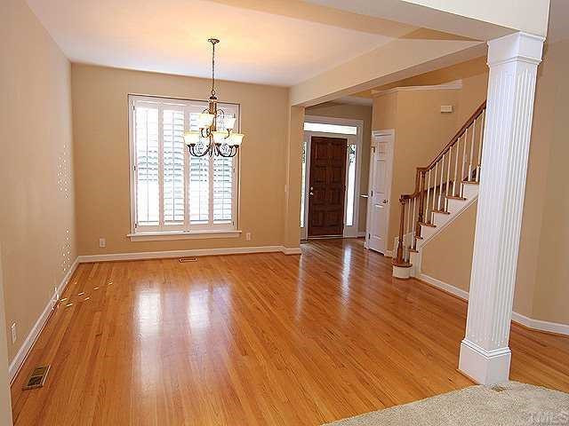 2936 Tillinghast Trail Raleigh, NC 27613 - Photo 2 of 12 Large dining room with plantation shutters and hardwood floors Other