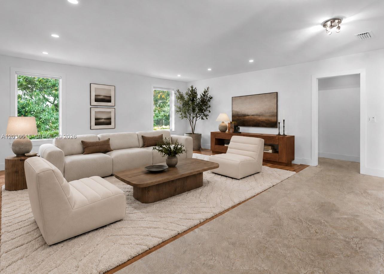 7711 Erwin Road Coral Gables, FL 33143 - Photo 3 of 26 a living room with furniture and a flat screen tv