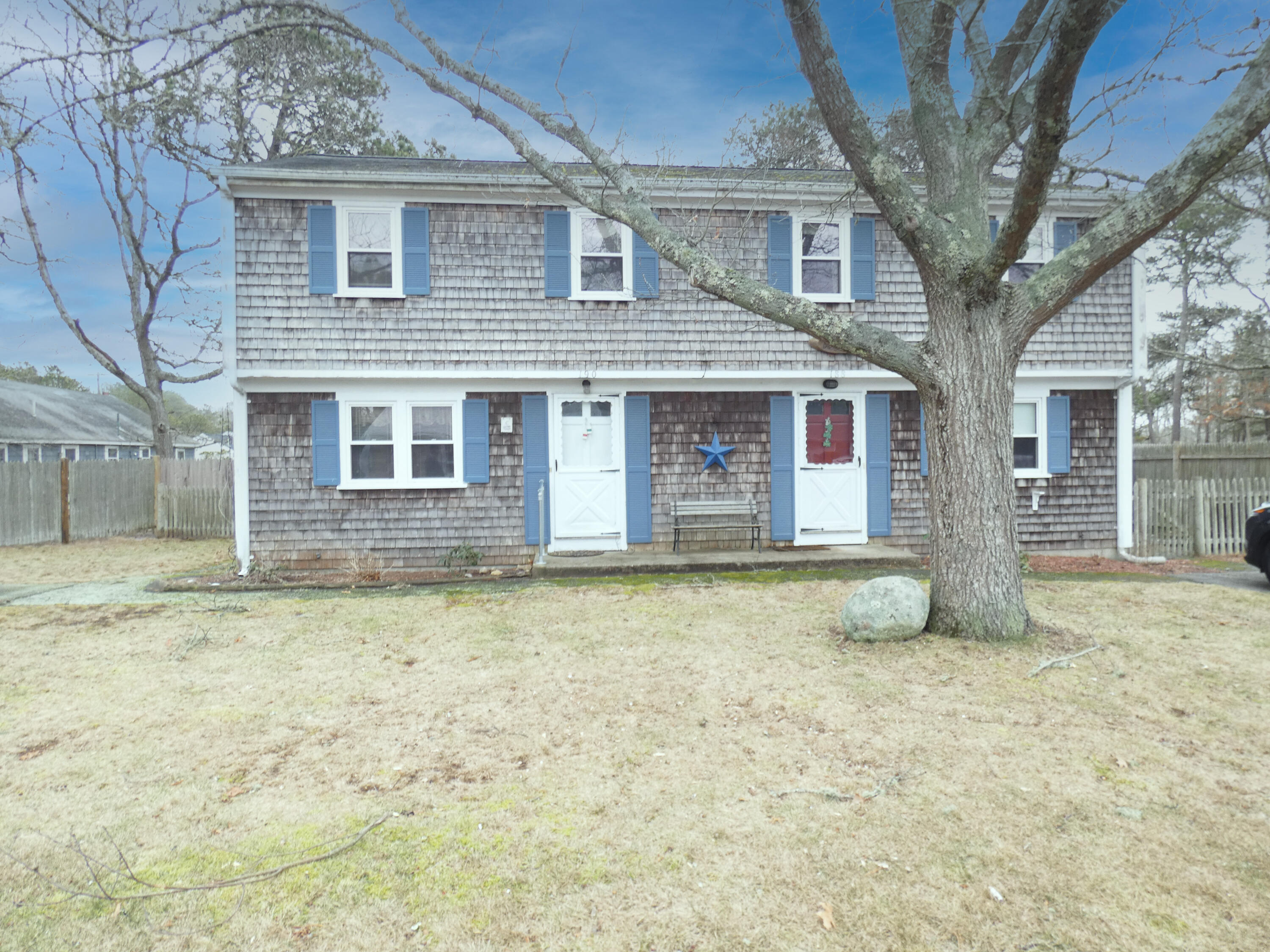 a front view of a house with a yard