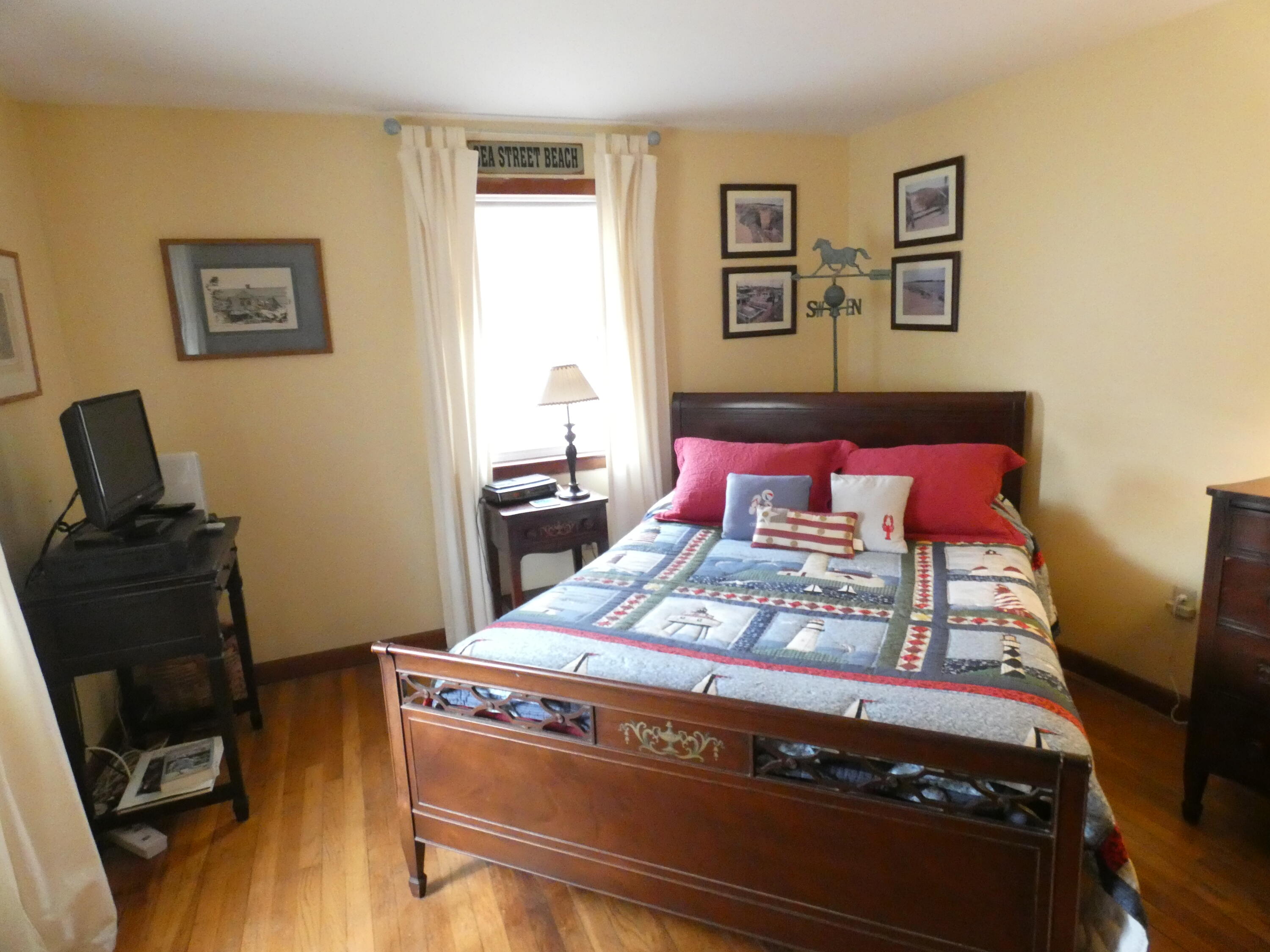 188 Swan River Road West Dennis, MA 02670 - Photo 11 of 39 a bedroom with a bed and wooden floor