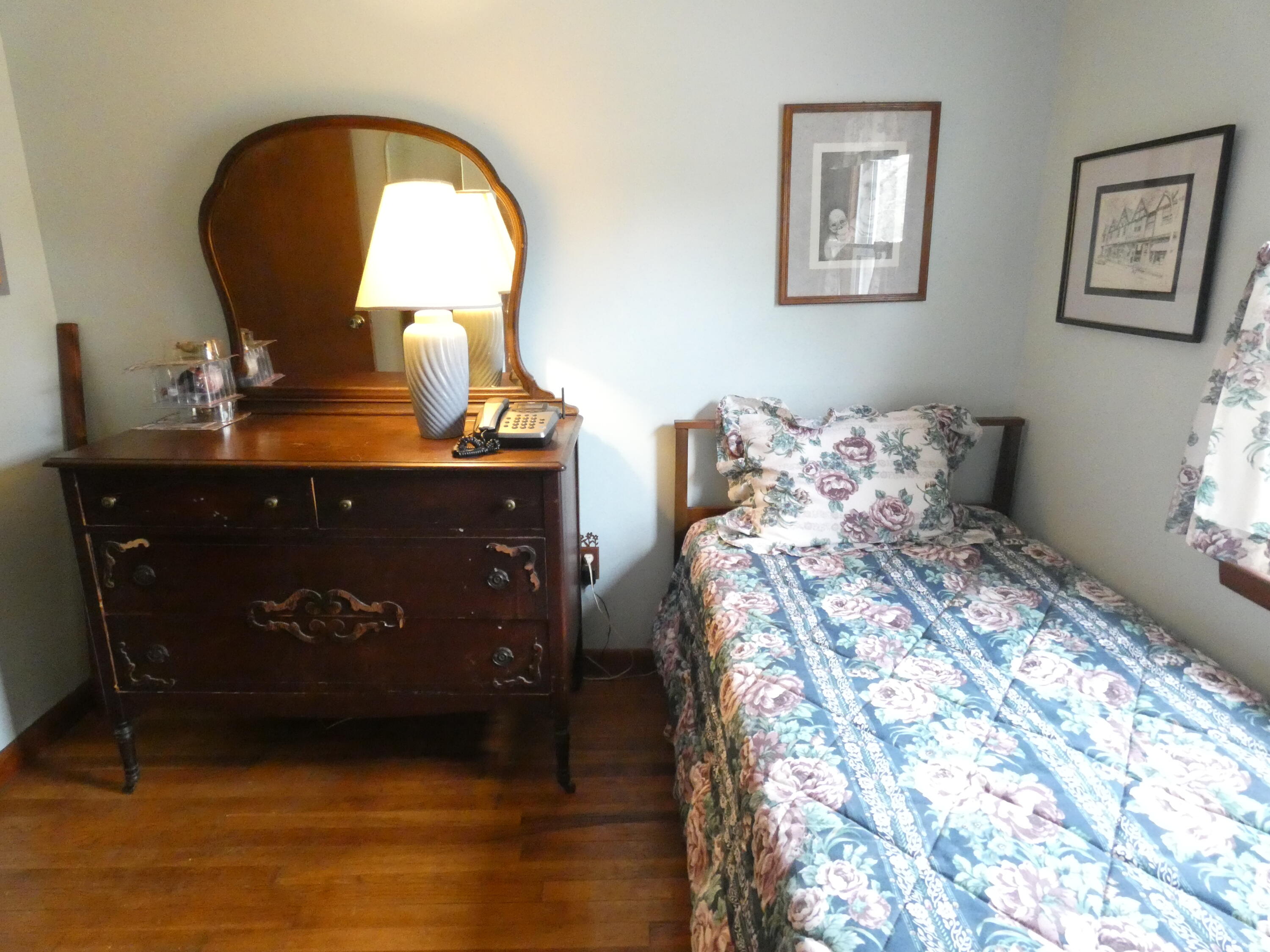 188 Swan River Road West Dennis, MA 02670 - Photo 16 of 39 a bed sitting in a bedroom next to a window