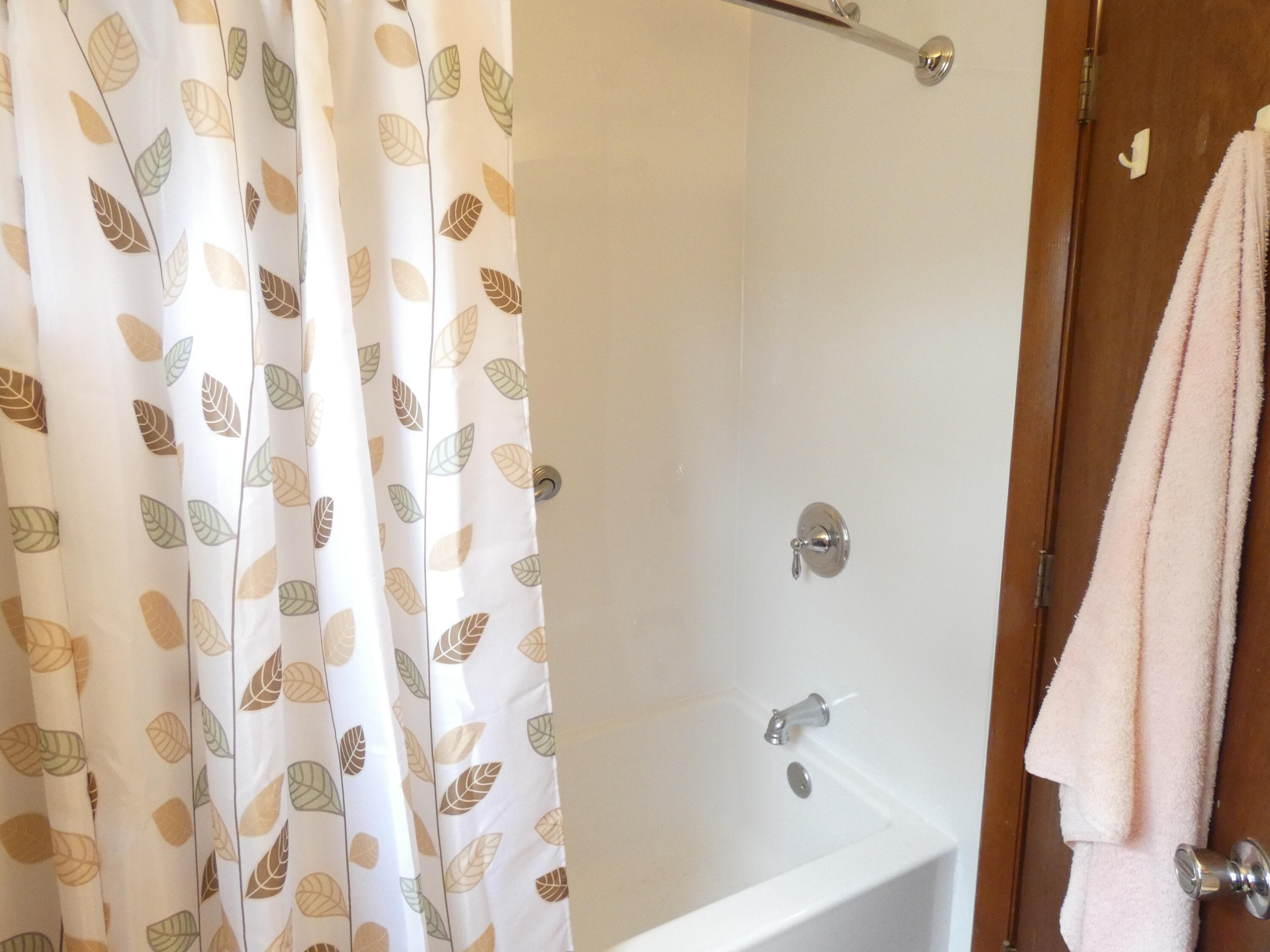 188 Swan River Road West Dennis, MA 02670 - Photo 19 of 39 a bathroom with a bathtub and a shower