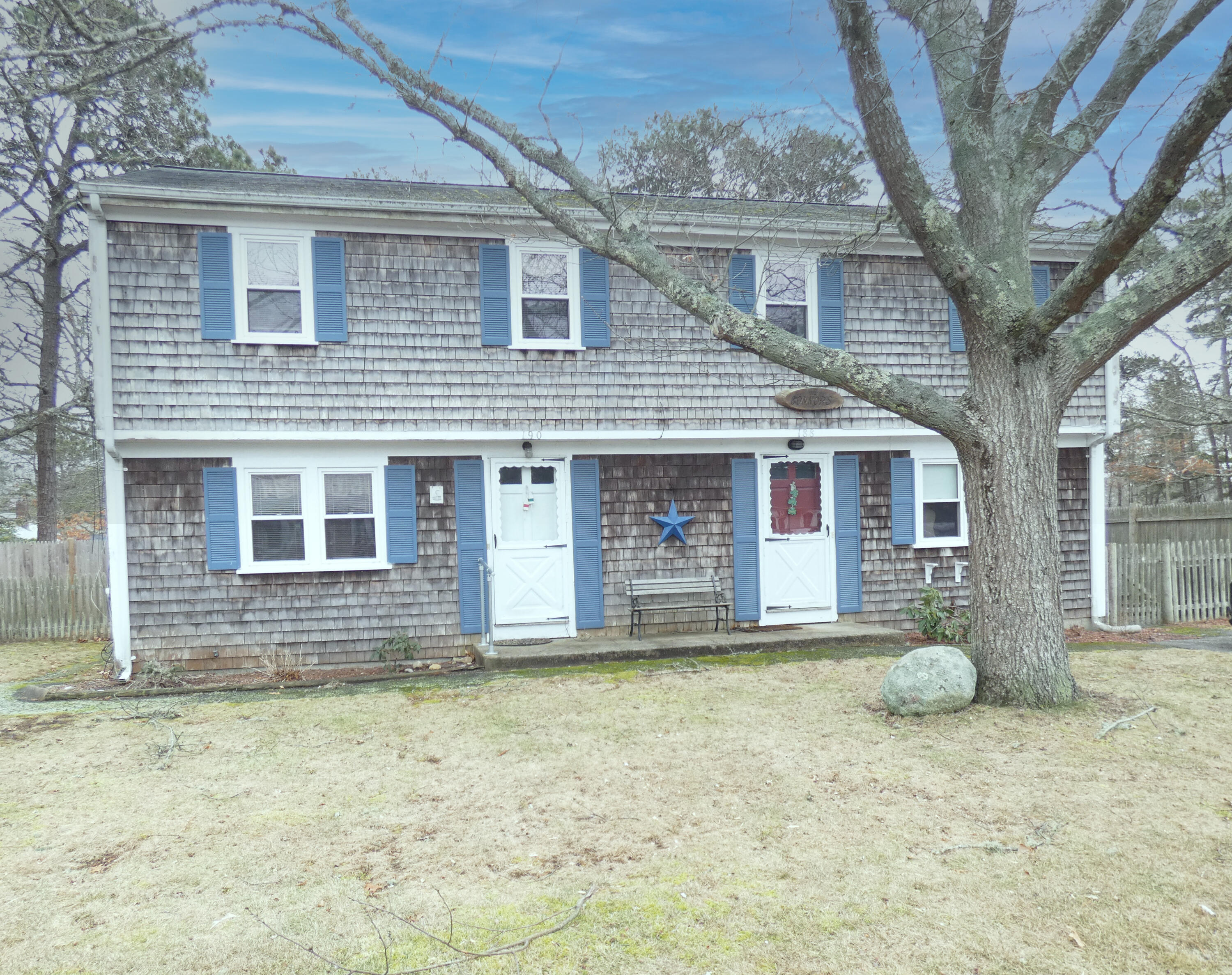 188 Swan River Road West Dennis, MA 02670 - Photo 2 of 39 a front view of a house with a yard