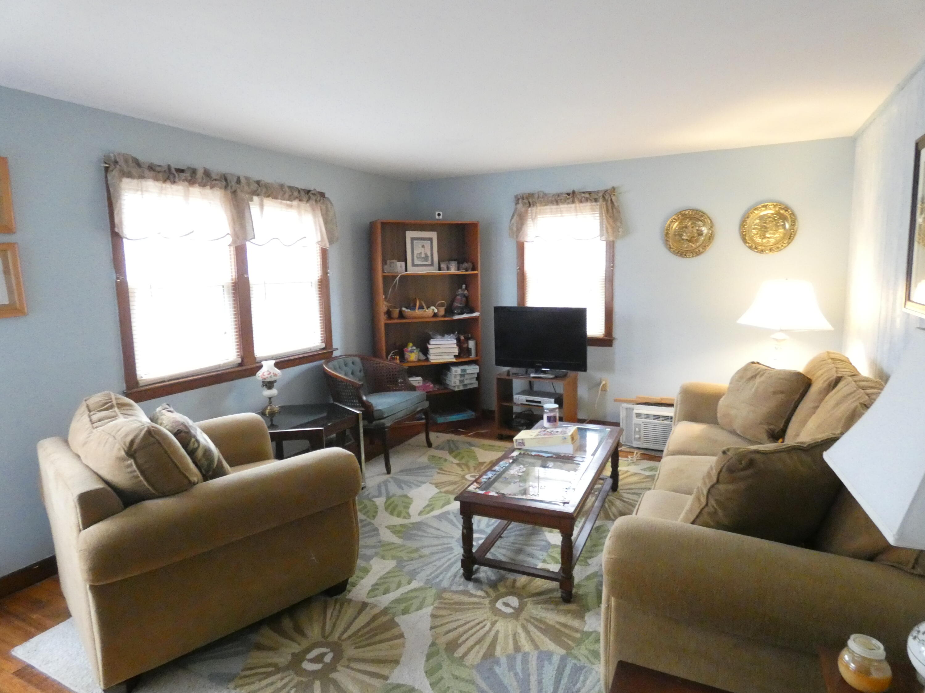 188 Swan River Road West Dennis, MA 02670 - Photo 22 of 39 a living room with furniture and a flat screen tv