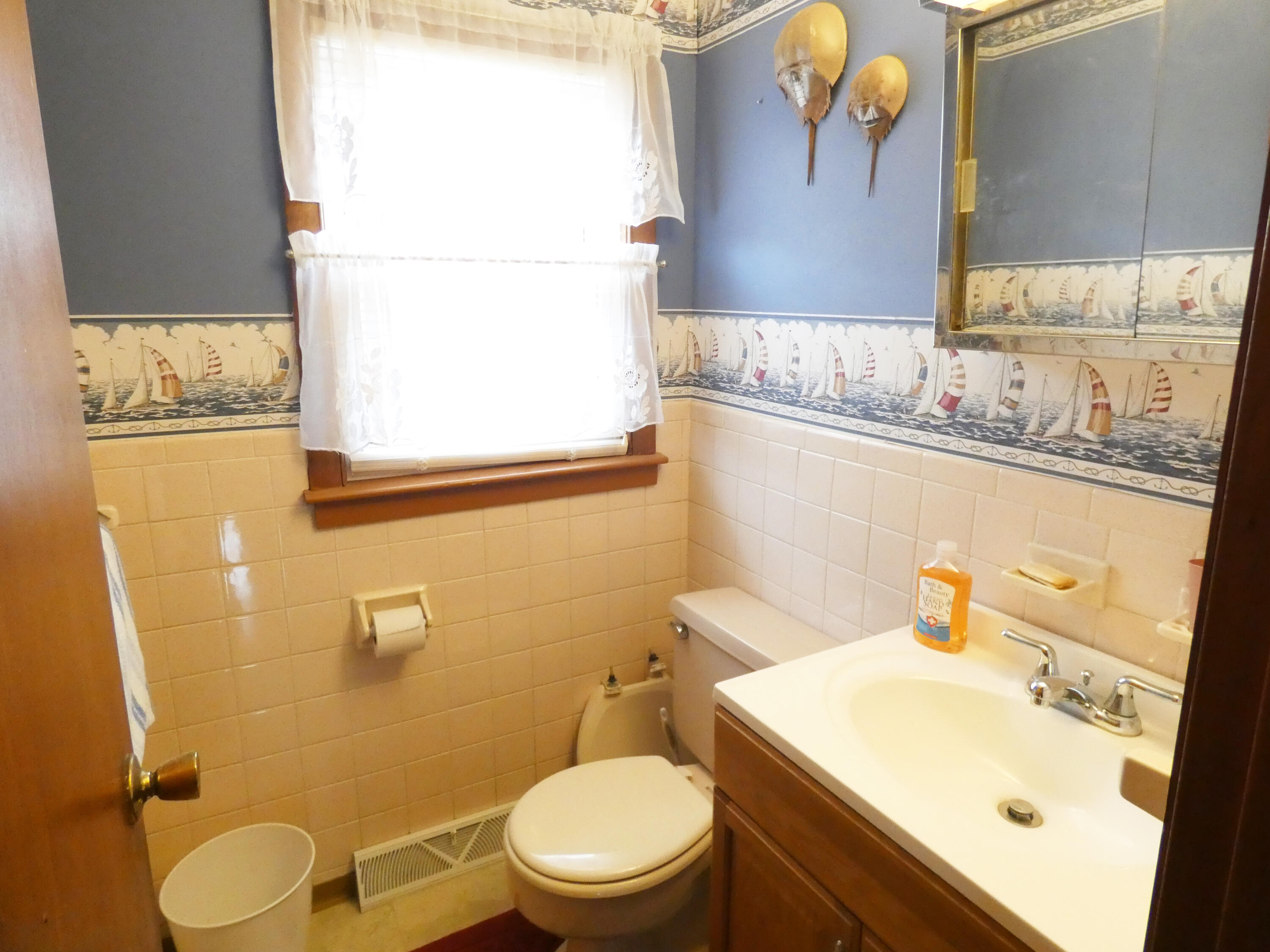 188 Swan River Road West Dennis, MA 02670 - Photo 26 of 39 a bathroom with a sink mirror vanity and toilet