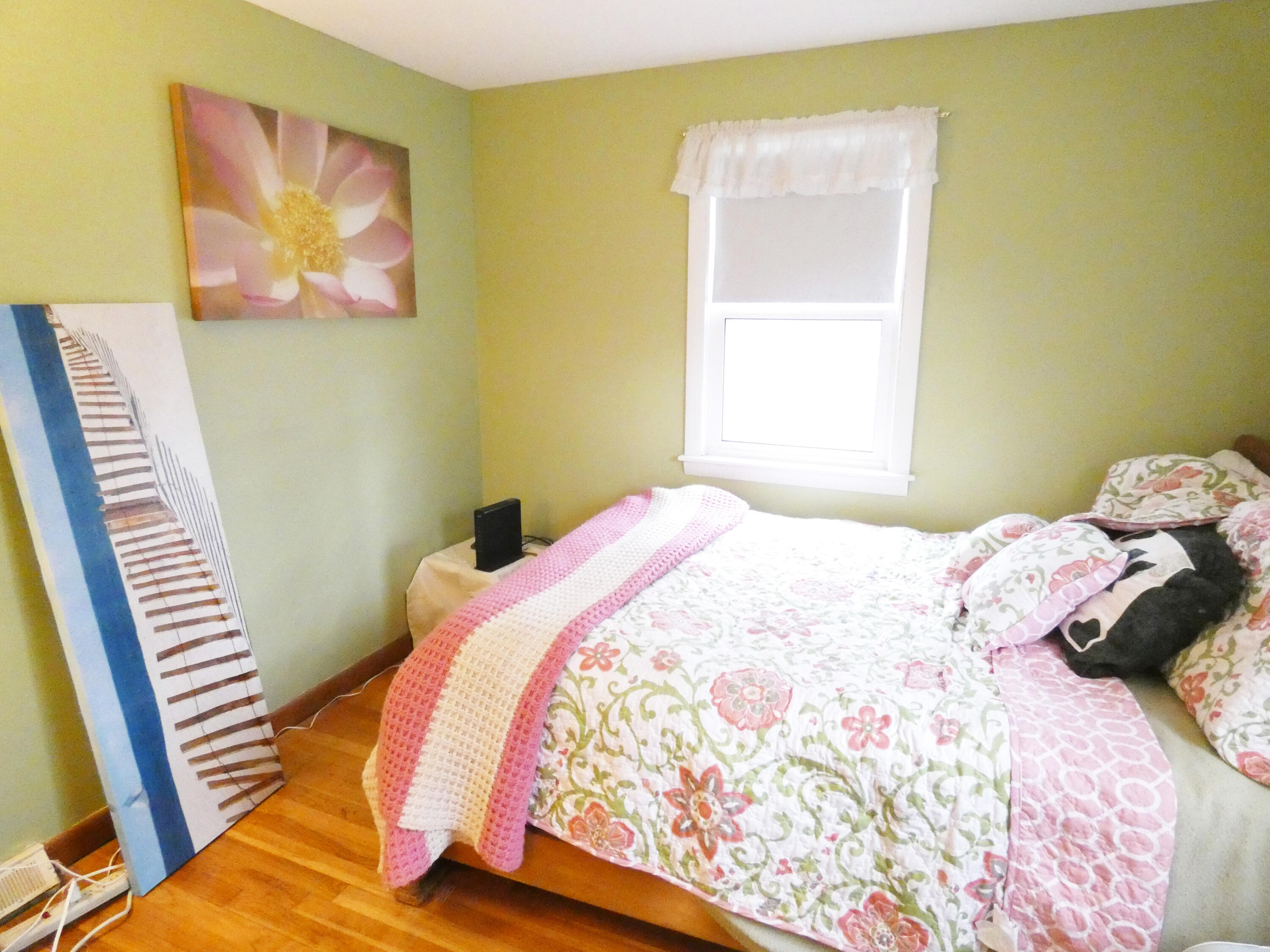 188 Swan River Road West Dennis, MA 02670 - Photo 28 of 39 a bedroom with a bed and a painting on the wall